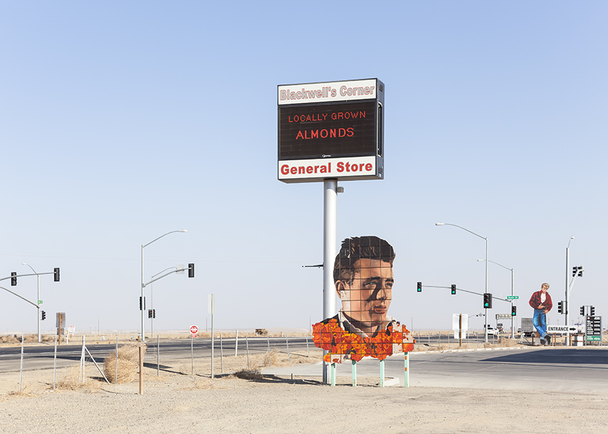 Cutouts and homages to James Dean sit in front of a general store and service station where locally grown almonds are sold