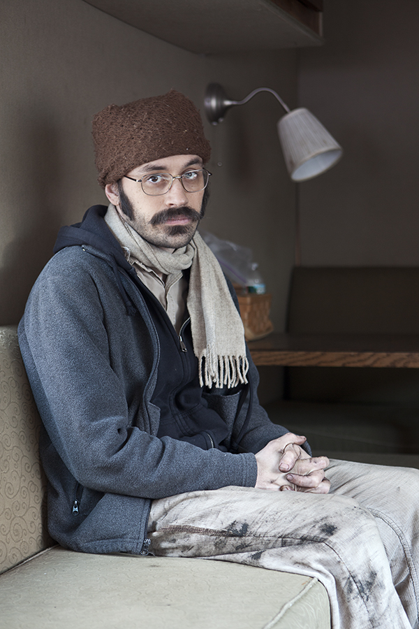 The singer for the band mewithoutyou relaxes on their tourbus before a show in Pittsburgh, Pennsylvania with Sainthood Reps